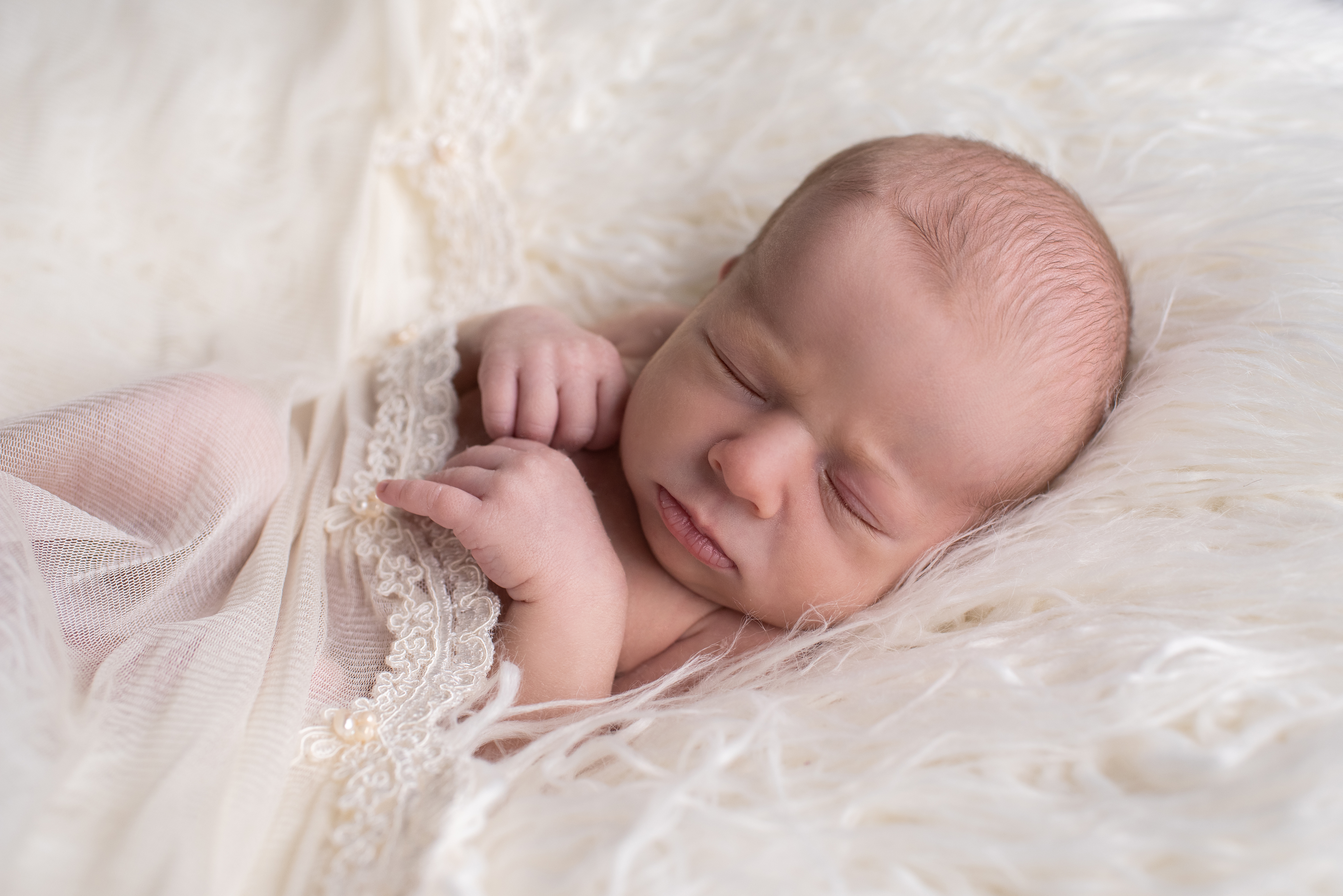baby girl on flokati, mother's veil
